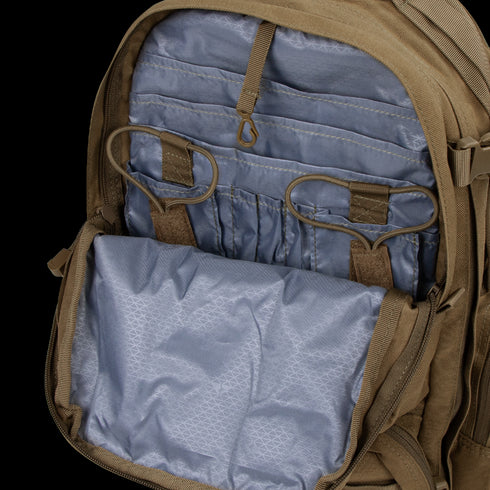 Open compartment of the Condor Convoy Backpack 22L reveals multiple interior pockets and elastic loops on a light blue lining—perfect for First Responder gear or Shooting Range essentials.