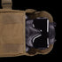 The Condor Gas Mask Leg Rig, in black, is partially tucked inside a tan bag with a Velcro flap—perfect gear for first responders or law enforcement.