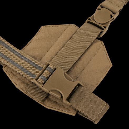 A close-up of the Condor LCS Drop Leg Panel shows a tan nylon strap with a plastic side-release buckle attached to its padded, hexagonal fabric panel.