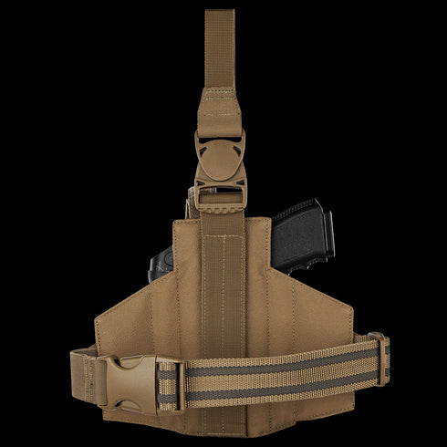 The Condor LCS RDS Leg Holster is a brown tactical thigh holster with an adjustable strap, shown in side view holding a black handgun, designed for law enforcement or military use, displayed against a white background.