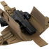 A black handgun with an optic sight is stored in a Condor LCS RDS Leg Holster, featuring tan color, straps, and Velcro flaps, displayed on a white background.