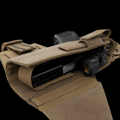 The Condor LCS RDS Leg Holster in tan features a secured flap, partially open to reveal space for a firearm accessory with a mounted light or laser—perfect for military or first responder use.