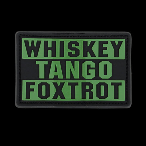 The Condor Whiskey Tango Foxtrot PVC Patch features bold olive drab letters on a black background, ideal for military personnel or collectors.