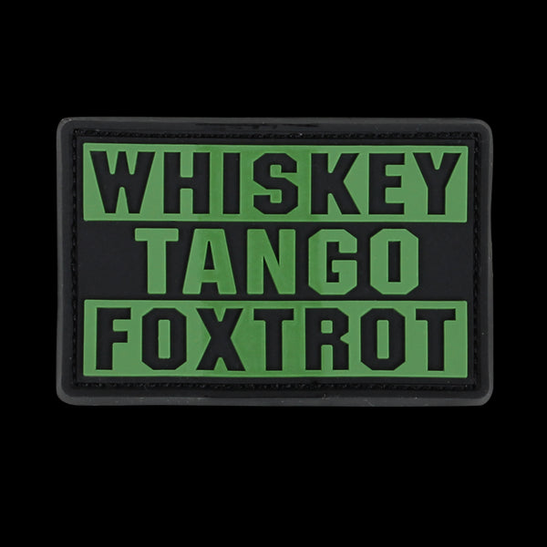 The Condor Whiskey Tango Foxtrot PVC Patch features bold olive drab letters on a black background, ideal for military personnel or collectors.