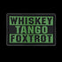 The Condor Whiskey Tango Foxtrot PVC Patch features bold olive drab letters on a black background, ideal for military personnel or collectors.