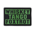 The Condor Whiskey Tango Foxtrot PVC Patch features bold olive drab letters on a black background, ideal for military personnel or collectors.