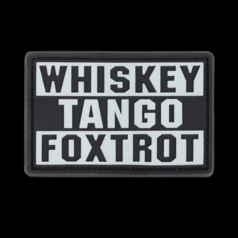 The Condor Whiskey Tango Foxtrot PVC Patch in graphite displays “WHISKEY TANGO FOXTROT” in bold white capitals over three lines—a popular phrase among military personnel.