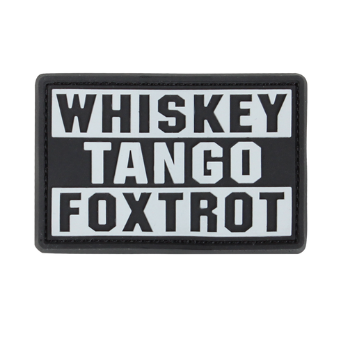 The Condor Whiskey Tango Foxtrot PVC Patch in graphite displays “WHISKEY TANGO FOXTROT” in bold white capitals over three lines—a popular phrase among military personnel.