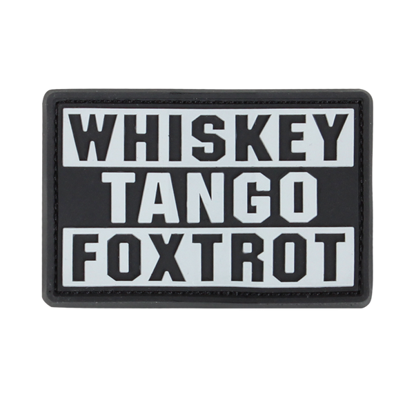 The Condor Whiskey Tango Foxtrot PVC Patch in graphite displays “WHISKEY TANGO FOXTROT” in bold white capitals over three lines—a popular phrase among military personnel.