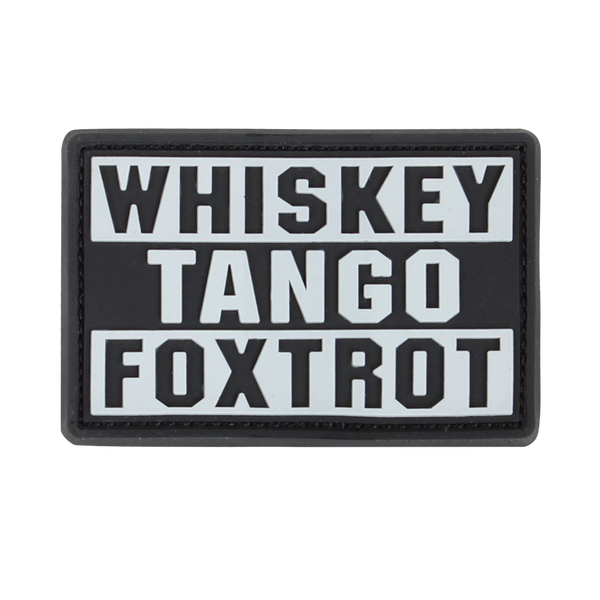 The Condor Whiskey Tango Foxtrot PVC Patch in graphite displays “WHISKEY TANGO FOXTROT” in bold white capitals over three lines—a popular phrase among military personnel.