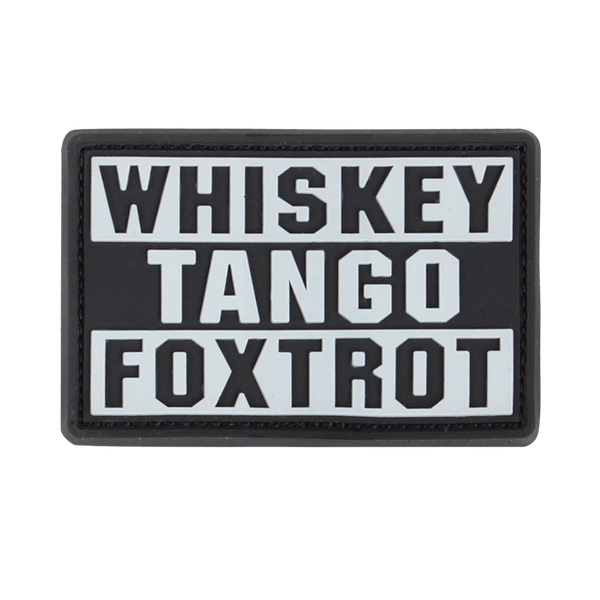 The Condor Whiskey Tango Foxtrot PVC Patch in graphite displays “WHISKEY TANGO FOXTROT” in bold white capitals over three lines—a popular phrase among military personnel.