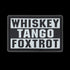 The Condor Whiskey Tango Foxtrot PVC Patch in graphite displays “WHISKEY TANGO FOXTROT” in bold white capitals over three lines—a popular phrase among military personnel.