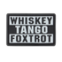 The Condor Whiskey Tango Foxtrot PVC Patch in graphite displays “WHISKEY TANGO FOXTROT” in bold white capitals over three lines—a popular phrase among military personnel.