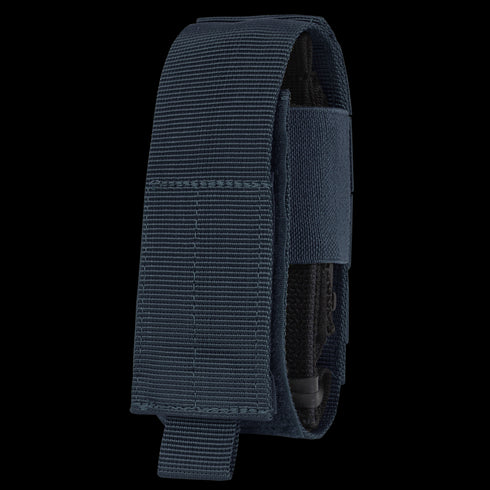 The Condor Universal TQ Pouch in navy nylon features a Velcro closure for tourniquet or small tool storage and is shown upright against a white background.