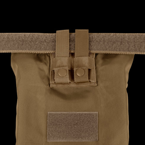 A close-up of the tan Condor Micro Dump Pouch featuring two snap button straps and a front velcro patch, perfect for compact storage preferred by tactical operators.