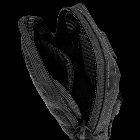 A close-up view of the Condor Dip Pouch in black, unzipped to reveal its multiple internal compartments.