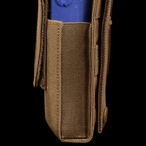 A close-up side view of the Condor Patrol Radio Pouch Gen II in tan fabric, featuring a flap with snap button securing a blue plastic object—perfect for bushcraft or shooting range use.