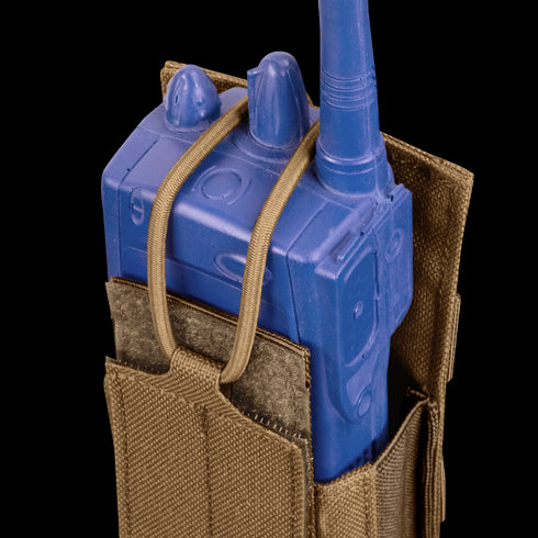 The Condor Patrol Radio Pouch Gen II in brown securely holds a blue training radio with elastic straps, making it ideal for military use or as EDC gear at the shooting range.