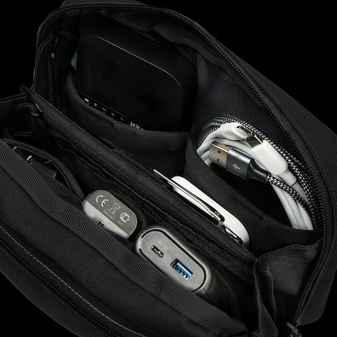 The Condor Tech Pouch - MultiCam Black is a versatile organizer for EDC, ideal for carrying power banks, charging cables, adapters, and a portable hard drive.