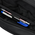 Close-up of the interior of the Condor Tech Pouch - MultiCam Black, showing two pens and a blue pen cap organized in dedicated pen slots.