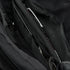 Close-up of the Condor Tech Pouch in MultiCam Black, displaying multiple zippered compartments and pockets with partially visible items inside.