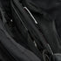 Close-up of the Condor Tech Pouch in MultiCam Black, displaying multiple zippered compartments and pockets with partially visible items inside.