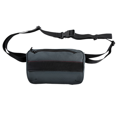 The Condor Tech Pouch is a small, rectangular, dark gray sling bag with a black adjustable shoulder strap and zippered main compartment—ideal for carrying your EDC or bushcraft essentials.