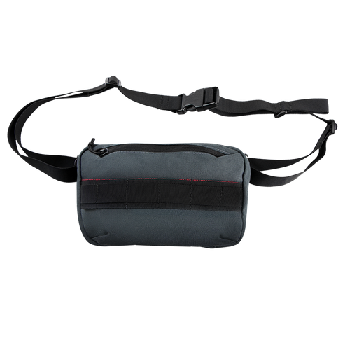 The Condor Tech Pouch is a small, rectangular, dark gray sling bag with a black adjustable shoulder strap and zippered main compartment—ideal for carrying your EDC or bushcraft essentials.