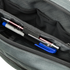 A close-up of the Tech Pouch by Condor in gray shows two pens—one with blue ink and one with silver trim—neatly organized in dedicated pen slots.