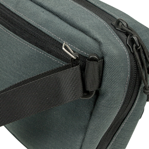 Close-up of the Condor Tech Pouch in dark green fabric, perfect for EDC or the range, featuring a black zipper, black strap, and silver hardware on one corner.