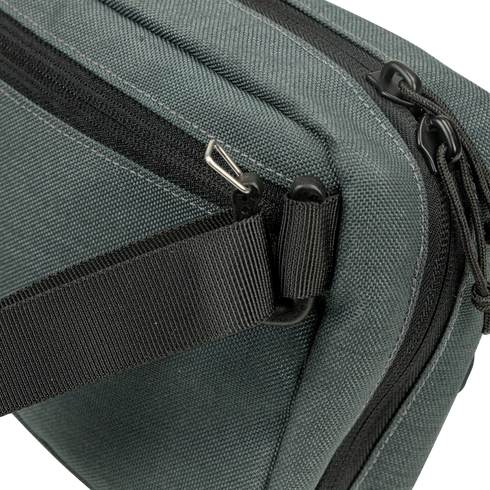Close-up of the Condor Tech Pouch in dark green fabric, perfect for EDC or the range, featuring a black zipper, black strap, and silver hardware on one corner.