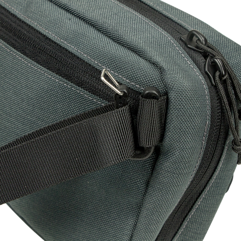 Close-up of the Condor Tech Pouch in dark green fabric, perfect for EDC or the range, featuring a black zipper, black strap, and silver hardware on one corner.