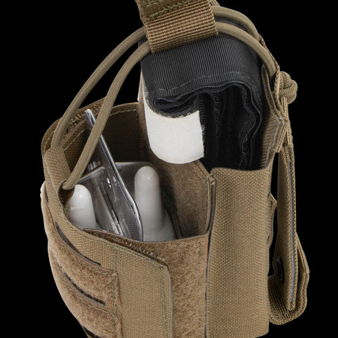 The Condor Narcan Pouch in tan holds a tourniquet, medical shears, and other instruments, with Velcro and strap closures—ideal for military, EDC, or bushcraft use.