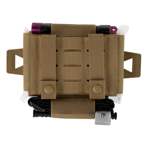 The Condor Micro TK Pouch Gen II is a tan tactical pouch with straps, side loops, medical supplies partially visible at the top, and a black tourniquet secured at the bottom.