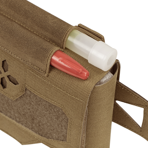 A close-up of the Condor Micro TK Pouch Gen II in tan, showing a red pen and white-capped tube inside, plus hook-and-loop patch and strap—perfect for organizing first responder essentials.