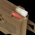 A close-up of the Condor Micro TK Pouch Gen II in tan, showing a red pen and white-capped tube inside, plus hook-and-loop patch and strap—perfect for organizing first responder essentials.