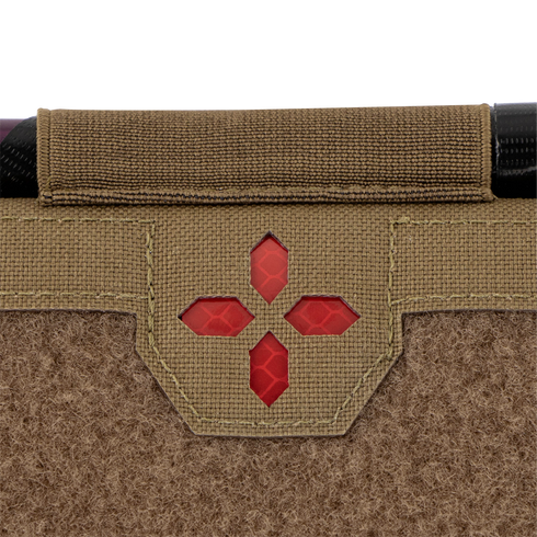 Close-up of the Condor Micro TK Pouch Gen II, featuring tan textured fabric, a red cross-shaped window, and black trim at the top.