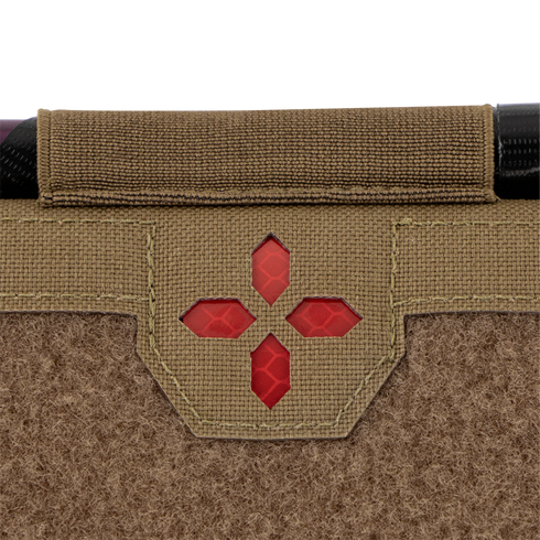 Close-up of the Condor Micro TK Pouch Gen II, featuring tan textured fabric, a red cross-shaped window, and black trim at the top.