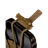 A close-up of the Condor LACE Phone Pouch—a brown tactical pouch featuring a tan buckle strap and elastic cords, holding a smartphone against a plain white background.