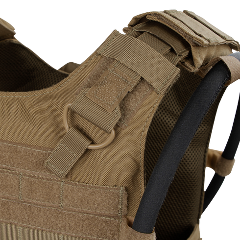 Close-up of the Condor Gunner Plate Carriers tan shoulder strap, featuring MOLLE webbing, D-ring, hook-and-loop fasteners, and hydration tube—perfect for bushcraft or law enforcement EDC.