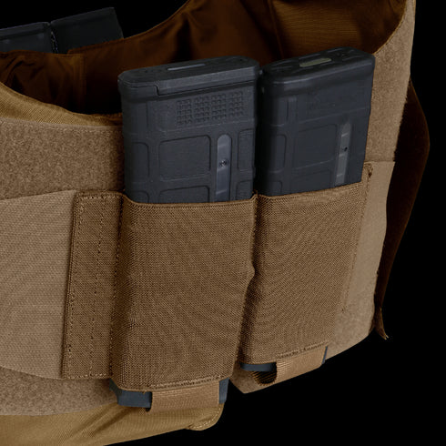 Two black rifle magazines are secured in tan fabric pouches on the Condor LCS Vanquish LT Plate Carrier, a tactical vest designed for law enforcement and tactical use.
