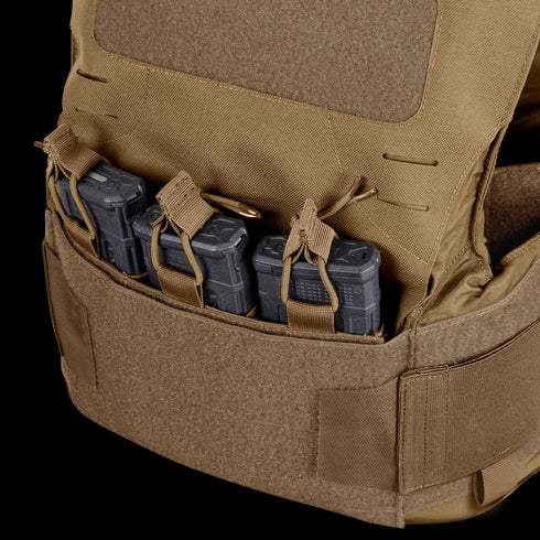 The Condor LCS Vanquish LT Plate Carrier in tan is built for military and tactical use, featuring three black rifle magazines held in front pouches with secure straps and hook-and-loop fasteners.