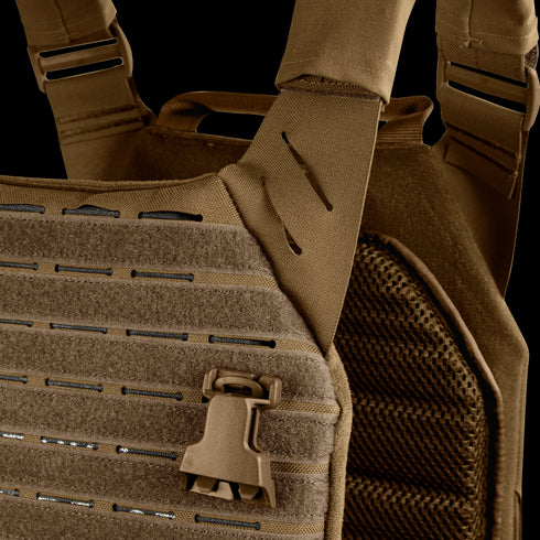 Close-up of the Condor Elite LCS Vanquish Plate Carrier by Condor, showing MOLLE webbing, quick-release buckle, and reinforced stitching in tan—engineered for military and law enforcement professionals.
