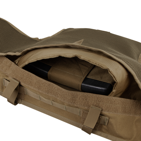 Close-up of an open pocket with MOLLE webbing on the Condor Enforcer Releasable Plate Carrier | SALE, showing a ballistic plate partially inserted inside the compartment.