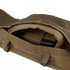 Close-up of an open pocket with MOLLE webbing on the Condor Enforcer Releasable Plate Carrier | SALE, showing a ballistic plate partially inserted inside the compartment.