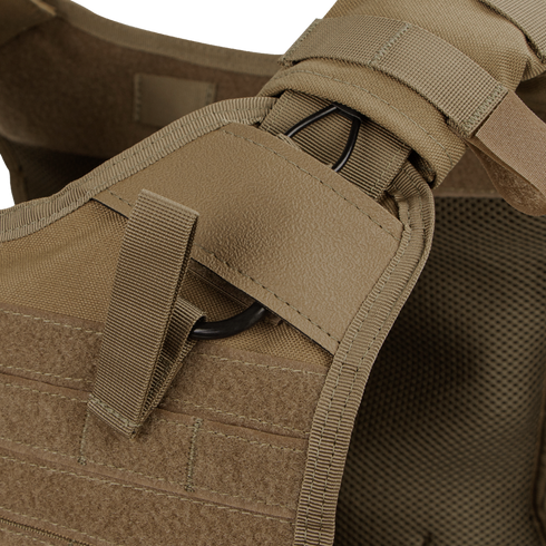Close-up of the Condor Enforcer Releasable Plate Carrier shoulder strap (tan), showcasing MOLLE webbing, Velcro, and a black metal ring.