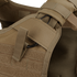 Close-up of the Condor Enforcer Releasable Plate Carrier shoulder strap (tan), showcasing MOLLE webbing, Velcro, and a black metal ring.