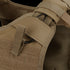 Close-up of the Condor Enforcer Releasable Plate Carriers tan shoulder strap, featuring loop, hook-and-loop fastener, and black D-ring—perfect for law enforcement or bushcraft use.