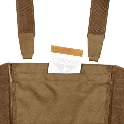 A tan envelope is partially tucked into the front pocket of a Condor LCS VAS Harness Kit, a brown utility vest featuring visible straps, often used by military personnel or at shooting ranges.