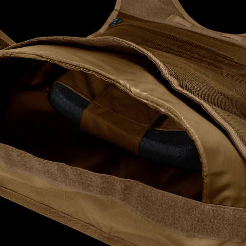 A close-up of the inside of the Condor EXO Plate Carrier Gen II reveals a black protective plate inserted into its pocket.